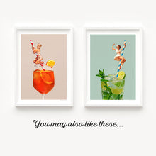 Load image into Gallery viewer, A glamorous 1950s pin-up girl takes center stage in “Retro Mojito Cocktail,” a retro art print designed for cocktail lovers. Posed on a blue and white striped straw in a fizzy mojito, this collage captures playful femininity and stylish nostalgia. Bursting with lime-green energy and summer vibes, it’s the perfect decor for retro kitchens, cocktail bars, cafes, or home entertaining spaces. Makes a fun and unique gift for mojito enthusiasts.