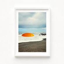 Load image into Gallery viewer, Whimsical surreal artwork titled Beach Egg showing a sunny egg yolk placed on a beach with ocean waves and rocky coastline, creating a bold dreamlike collage. Ideal wall decor for modern kitchens, quirky cafes, or beach-themed living spaces. Perfect gift for food lovers, surreal art enthusiasts, and coastal art collectors looking for unique posters that combine humor, nature, and imaginative storytelling in their home or business interiors