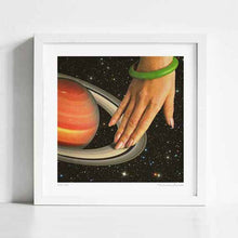 Load image into Gallery viewer, Cosmic Spin artwork featuring a woman's hand seamlessly integrated with Saturn's rings, creating a surreal and space-themed art piece. Perfect for modern decor and space enthusiasts looking for unique space-themed decor