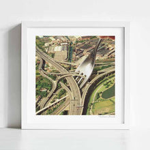 Load image into Gallery viewer, This surreal art print “Spaghetti Junction” combines the chaos of a highway interchange with the whimsy of Italian pasta night. A giant fork twists roads like spaghetti strands, creating a quirky and eye-catching collage. Perfect for fans of pasta, Italian food, kitchen wall art, or transport-inspired posters. Great for restaurants, cafés, or funky home décor, this trippy artwork merges food culture with urban design for a bold and imaginative pop art statement.