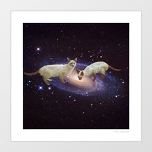 Load image into Gallery viewer, Surreal space art print showing two Siamese cats drinking milk in a cosmic galaxy setting with stars and nebula.