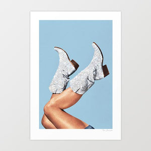 Illuminate your space with 'These Boots - Glitter Blue,' a striking digital artwork featuring glittery blue cowgirl boots set against a vibrant, energetic backdrop. This piece is perfect for adding a touch of glam and western charm to any decor, seamlessly blending boho-chic and modern styles. Ideal for home, office, or studio spaces, this artwork brings a bold, stylish vibe and a splash of color.